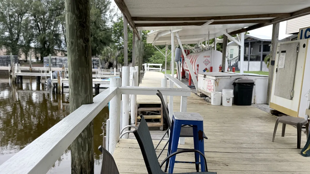 The covered dock walkway along the water